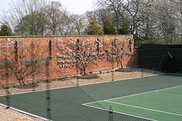 Two-tone Pladek tennis court surface in green by En Tout Cas